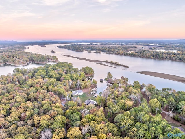 aerial view at dusk with a water view