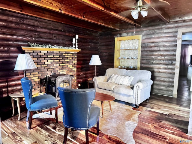 101 9th St W, Grant, AL 35747 - living area with a ceiling fan, wood finished floors, wood ceiling with exposed beams, and log walls