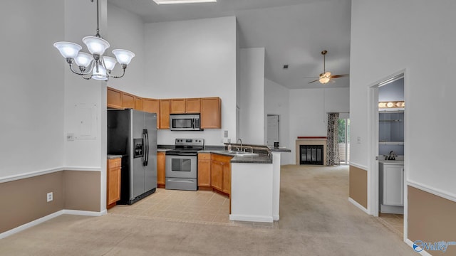 1155 Old Monrovia Rd NW Unit 2N, Huntsville, AL 35806 - kitchen with stainless steel appliances, high vaulted ceiling, a peninsula, dark countertops, and open floor plan