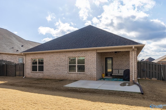 back of property with a patio