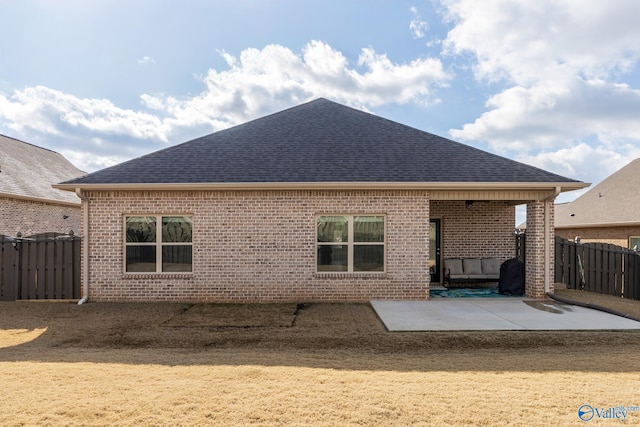 back of house with a patio