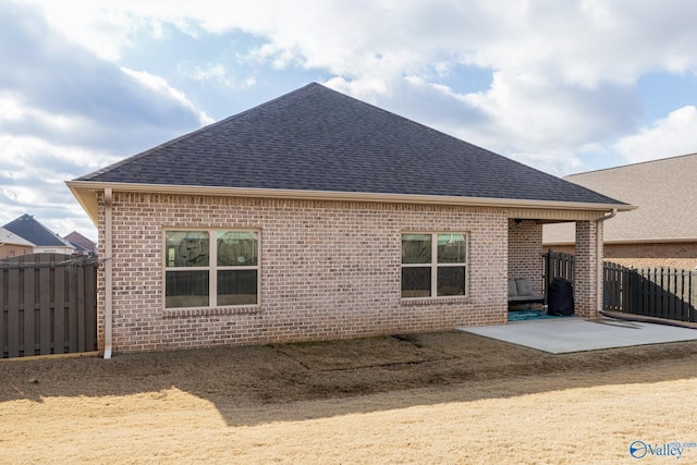 back of property with a patio