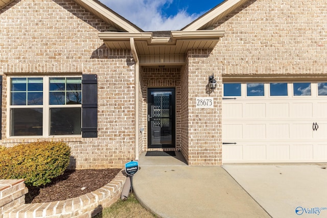 doorway to property featuring a garage