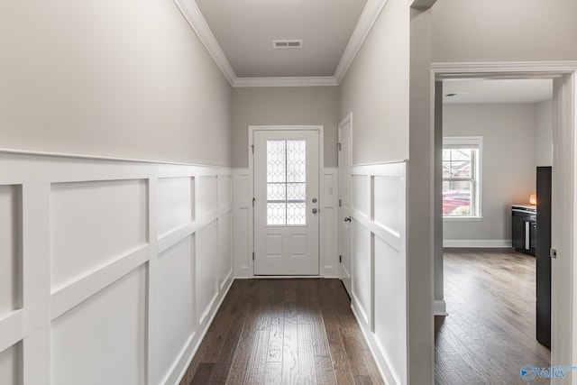 entryway featuring plenty of natural light, dark hardwood / wood-style floors, and ornamental molding