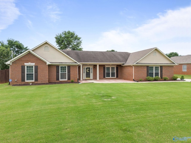 single story home with a patio and a front lawn