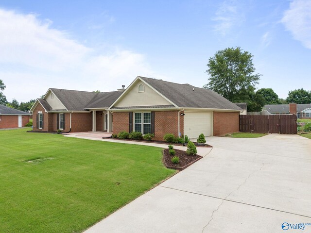 single story home with a garage and a front yard