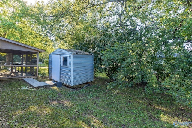 view of outbuilding featuring a lawn