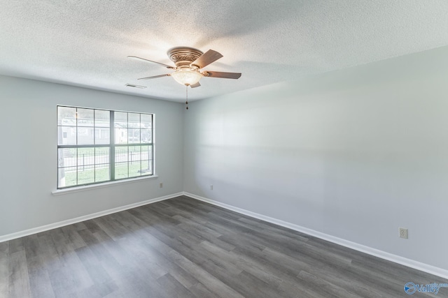 spare room featuring ceiling fan, a textured ceiling, and dark hardwood / wood-style flooring