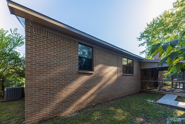 view of home's exterior with a patio and cooling unit