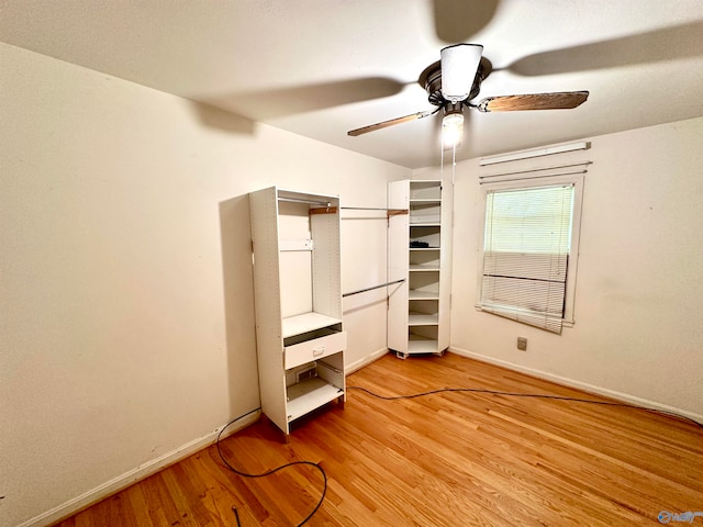 unfurnished bedroom featuring ceiling fan and light hardwood / wood-style flooring