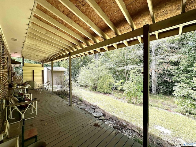 wooden deck with an outdoor structure