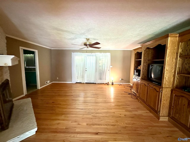 unfurnished living room with light hardwood / wood-style floors, built in features, ceiling fan, ornamental molding, and a textured ceiling