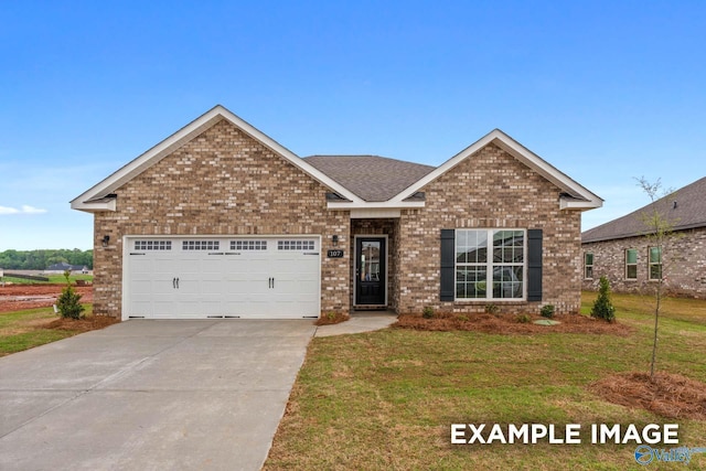 162 River Pointe Dr, New Market, AL 35761 - view of front of property featuring a front yard, brick siding, and driveway