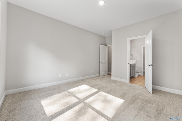 162 River Pointe Dr, New Market, AL 35761 - unfurnished bedroom with ensuite bath, light colored carpet, and baseboards