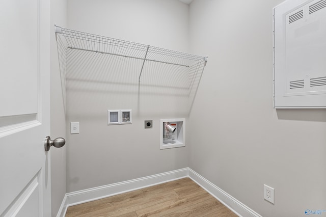 162 River Pointe Dr, New Market, AL 35761 - laundry area featuring laundry area, hookup for an electric dryer, hookup for a washing machine, baseboards, and light wood-style floors