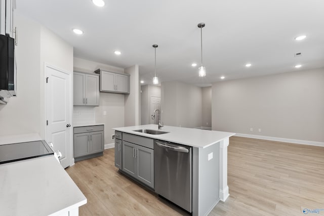 162 River Pointe Dr, New Market, AL 35761 - kitchen featuring a sink, light wood-type flooring, stainless steel dishwasher, decorative light fixtures, and gray cabinetry