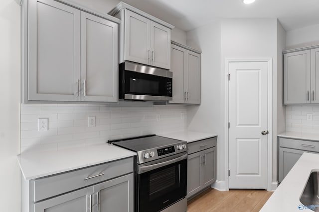 162 River Pointe Dr, New Market, AL 35761 - kitchen featuring gray cabinets and stainless steel appliances