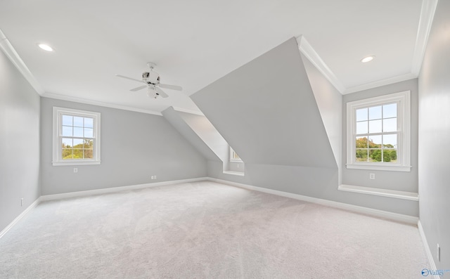 additional living space featuring ceiling fan, recessed lighting, light carpet, baseboards, and vaulted ceiling