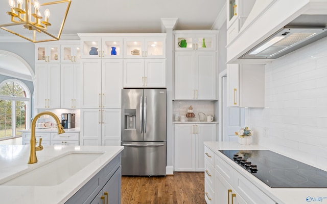 kitchen featuring white cabinetry, black electric cooktop, glass insert cabinets, and stainless steel refrigerator with ice dispenser