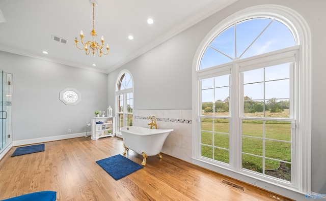 interior space featuring light wood-style floors, recessed lighting, visible vents, and ornamental molding