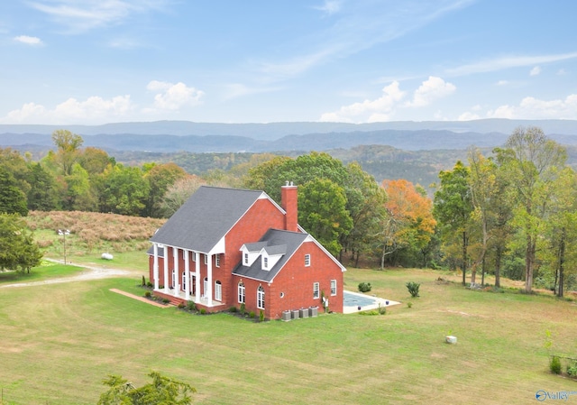 birds eye view of property with a mountain view