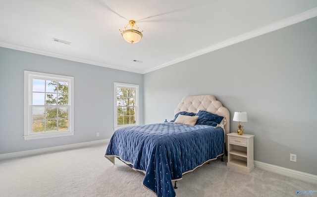 bedroom featuring carpet floors, ornamental molding, and baseboards