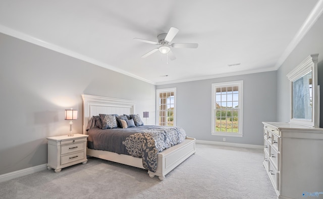 bedroom with light carpet, baseboards, and crown molding