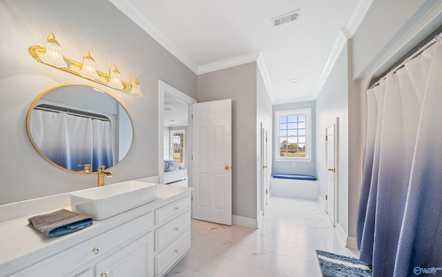 bathroom with baseboards, ornamental molding, visible vents, and a healthy amount of sunlight