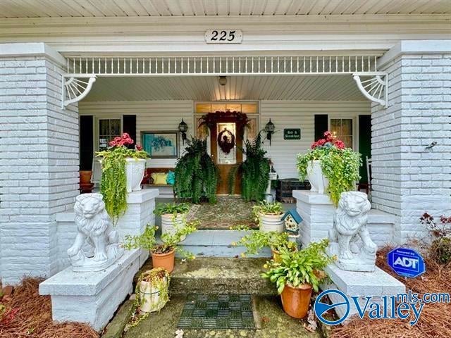 entrance to property with a porch