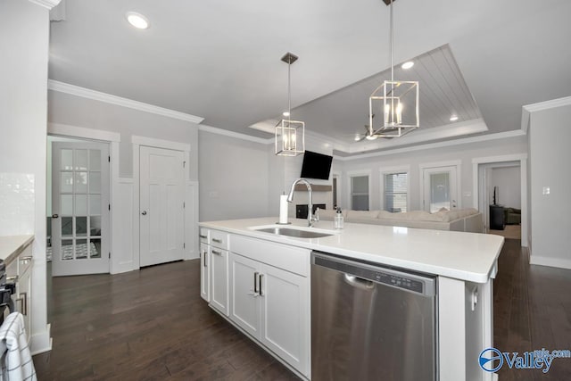 kitchen featuring dishwasher, pendant lighting, a kitchen island with sink, white cabinets, and sink