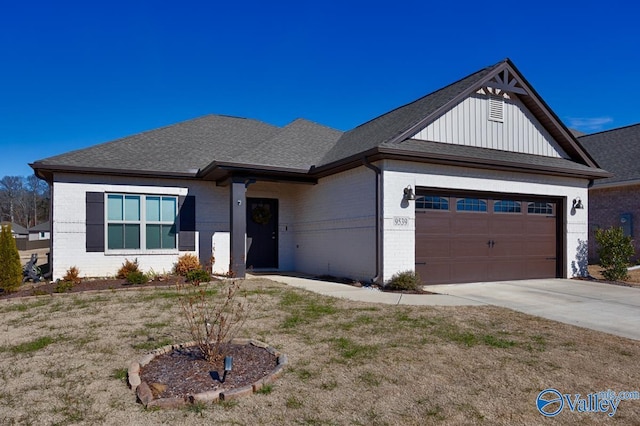 view of front of property with a front yard and a garage