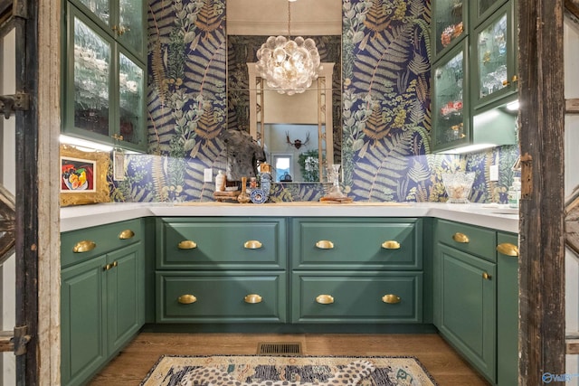 interior space with green cabinetry and dark hardwood / wood-style floors