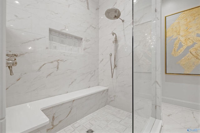 bathroom featuring tiled shower and tile patterned floors