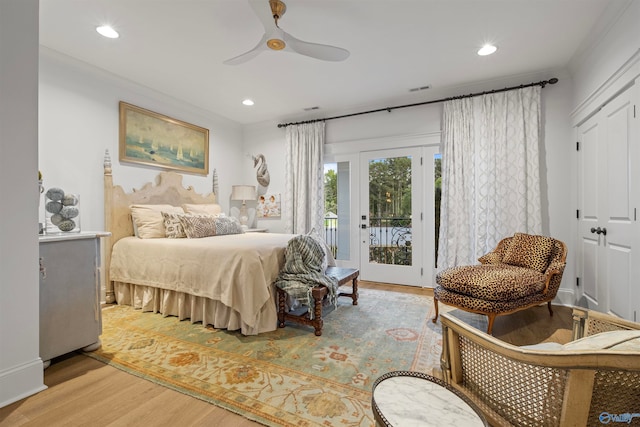 bedroom with crown molding, hardwood / wood-style flooring, access to exterior, and ceiling fan