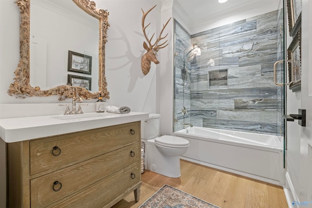 full bathroom featuring vanity, enclosed tub / shower combo, wood-type flooring, and toilet