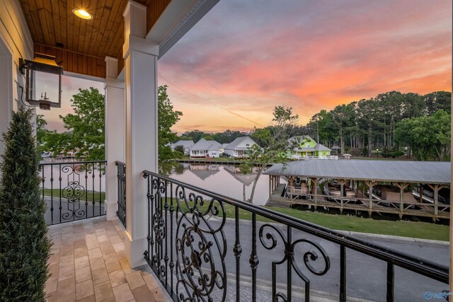 view of balcony at dusk