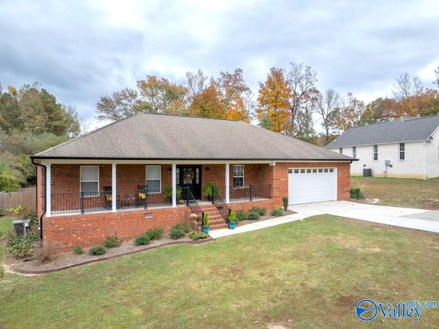 ranch-style home featuring a porch, a front yard, central AC unit, and a garage