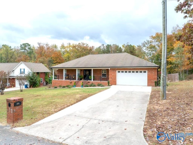 single story home featuring a front yard, a garage, and covered porch