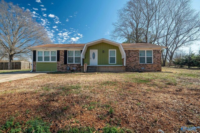 ranch-style home featuring a front yard