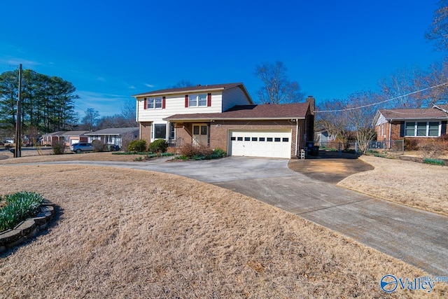 traditional-style house with brick siding, a chimney, fence, a garage, and driveway