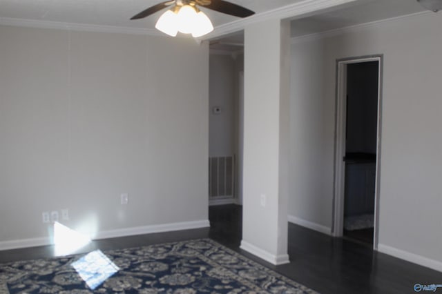 empty room with ceiling fan, crown molding, and dark hardwood / wood-style flooring