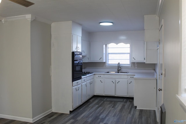 kitchen with white cabinets, oven, sink, and dark wood-type flooring