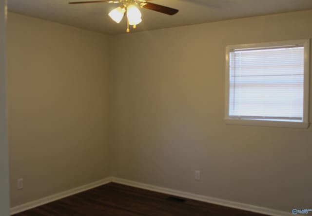 unfurnished room with ceiling fan and dark hardwood / wood-style floors