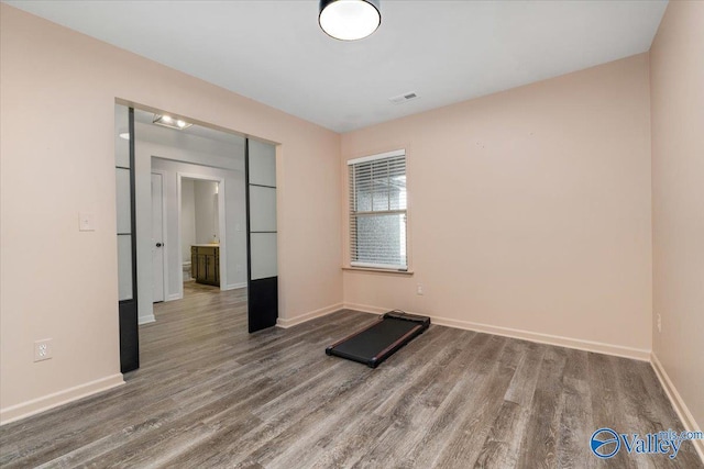 workout room featuring hardwood / wood-style flooring