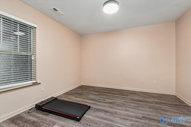 workout room with hardwood / wood-style floors