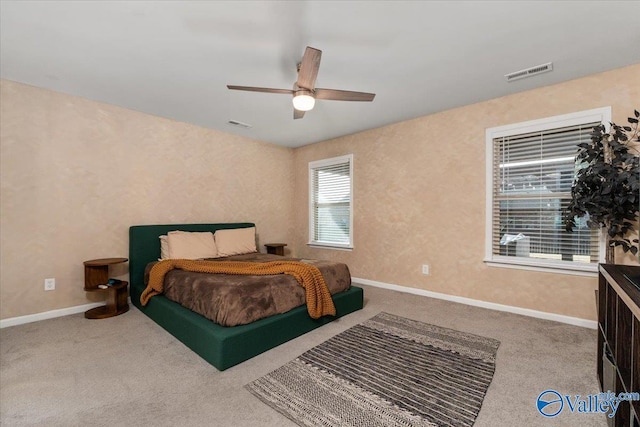 bedroom with ceiling fan and carpet floors