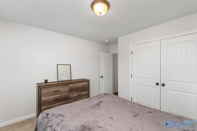 unfurnished bedroom featuring a closet and carpet flooring