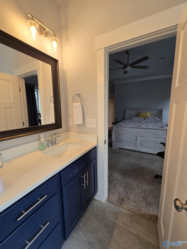 bathroom with tile patterned flooring, vanity, and a ceiling fan