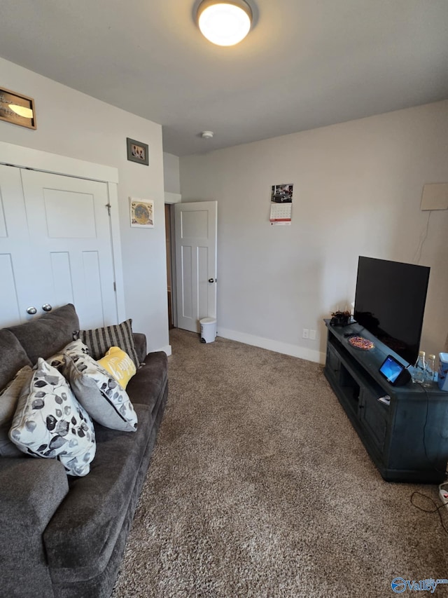 living room featuring baseboards and carpet