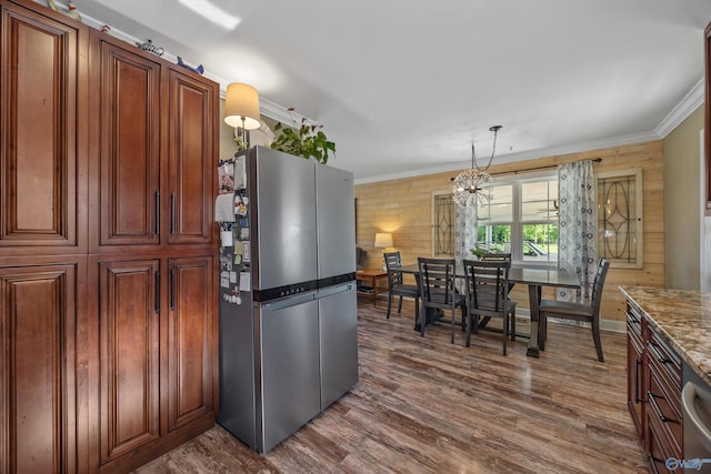 199 Ford Chapel Dr, Harvest, AL 35749 - kitchen featuring freestanding refrigerator, a chandelier, dark wood-style floors, ornamental molding, and pendant lighting